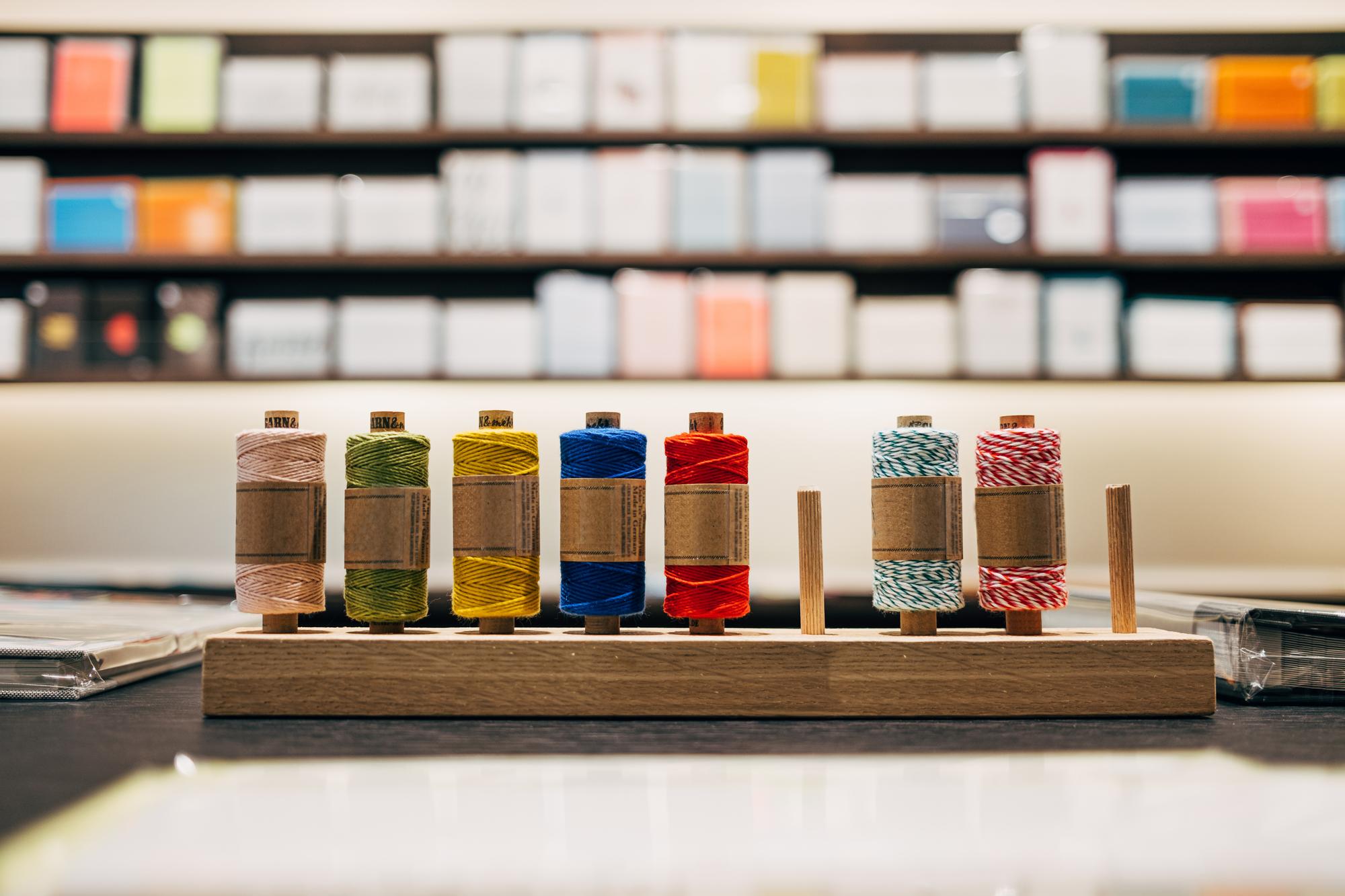 Studio table with threads and samplers